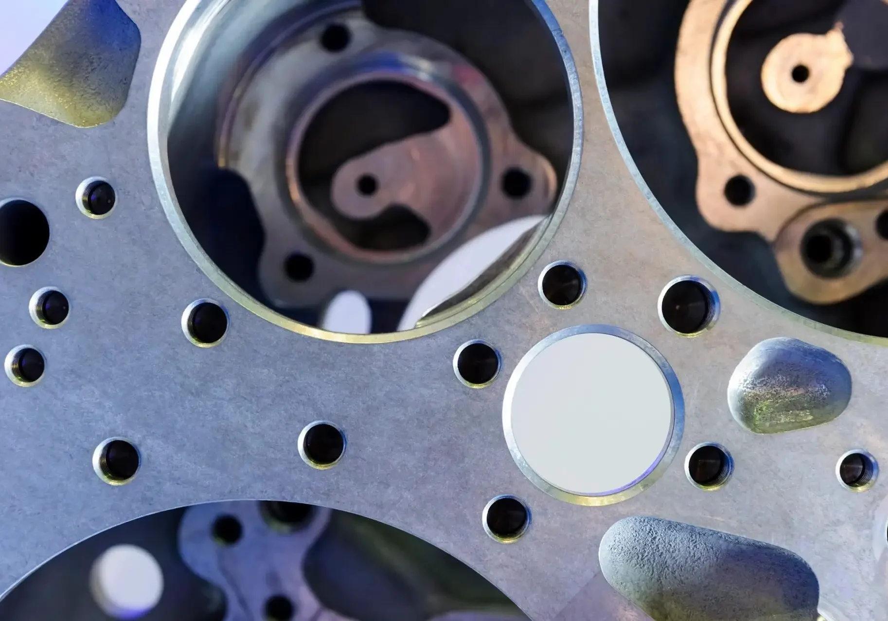 Close up looking through multiple metal wheel spokes