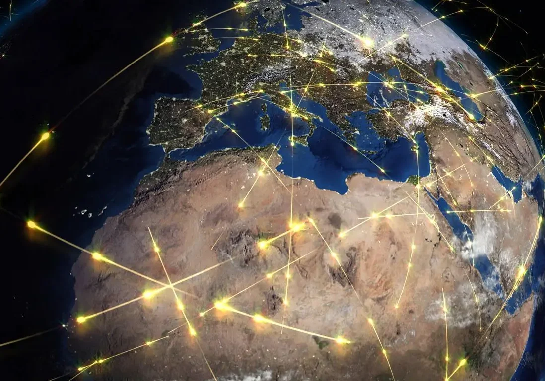 Shadowed Globe showing Europe and Africa superimposed with multiple glowing data points and connecting lines